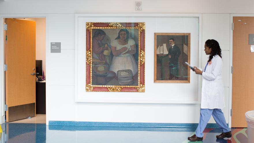 Two paintings on a wall