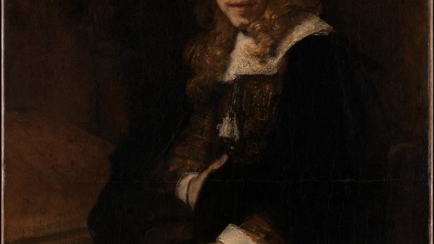 Portrait of a seated figure with long hair, wearing a hat and holding a paper